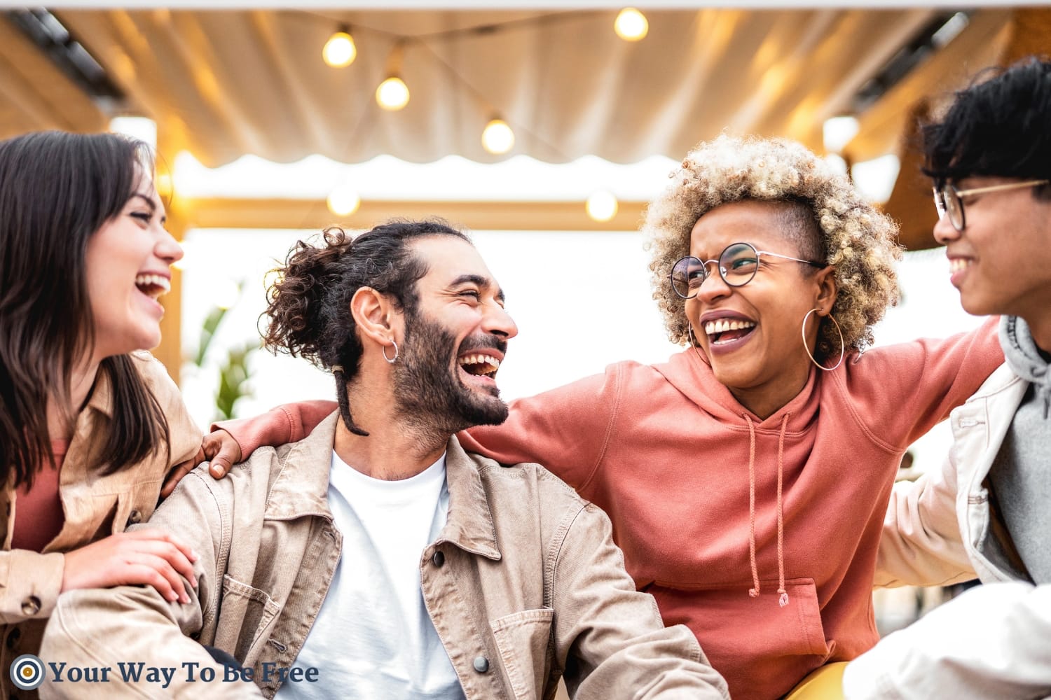 A group of friends laughing showing to importance to Connect To Be Happy