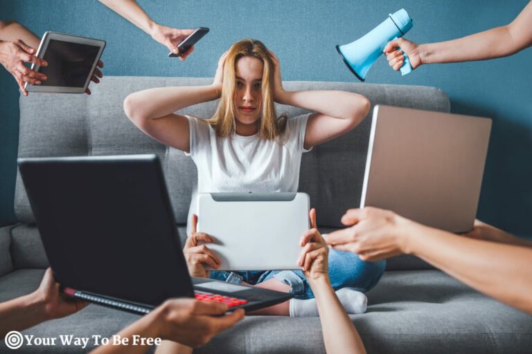 A girl surrounded by electronic devices underlying the need for digital detox