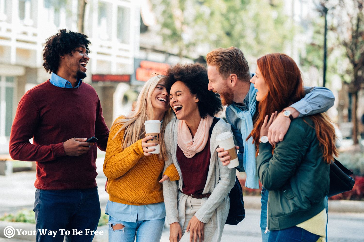 a group of friends taking a good laugh outdoors, lots of laughter