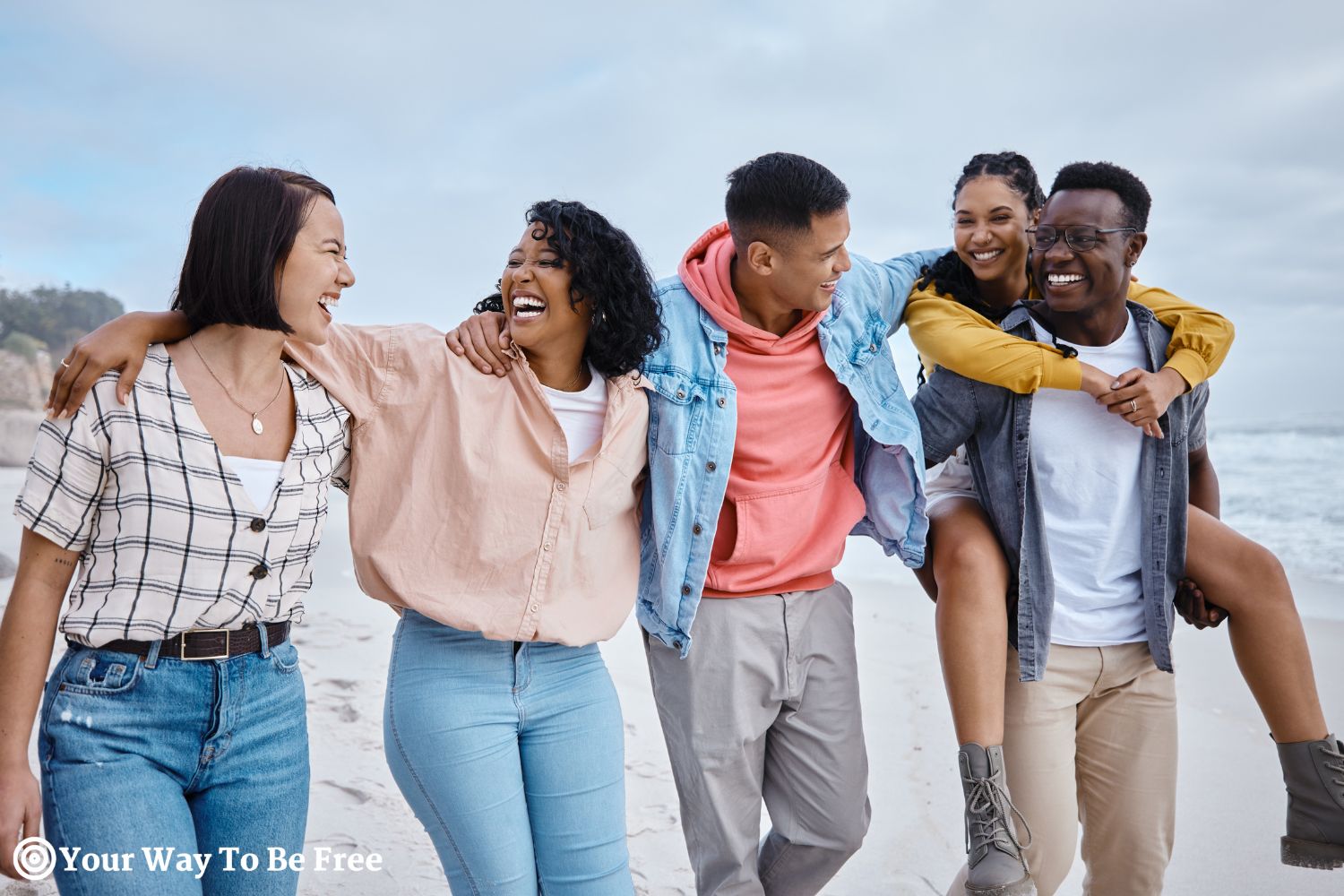 Friends, group and smile at beach, ocean and outdoor nature for fun, happiness and travel. connection, family