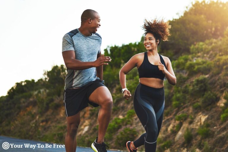 Fitness, exercise and couple running in nature by a mountain training for a race, marathon or competition. Sports, health and athletes or runners doing an outdoor cardio workout together at sunset. outdoor workout