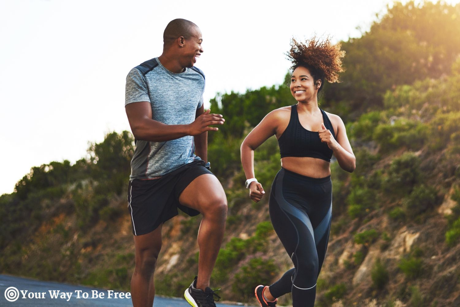 Fitness, exercise and couple running in nature by a mountain training for a race, marathon or competition. Sports, health and athletes or runners doing an outdoor cardio workout together at sunset. outdoor workout