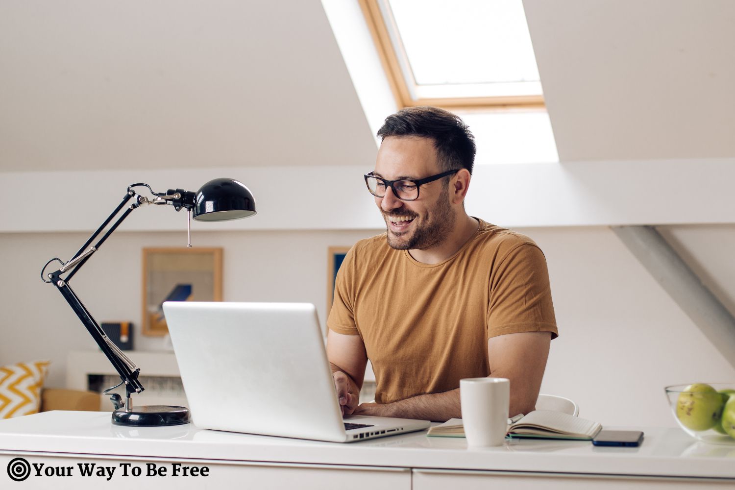 Happy man working from his home office. Mental health benefits of working from home